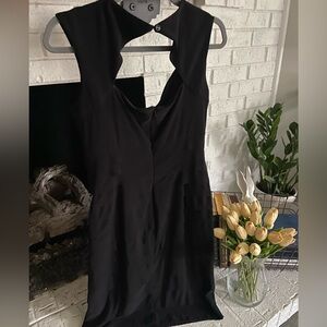 Classic Black Sleeveless Dress with Front Cutout
Size 8